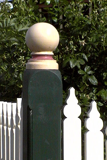 Round fence post capital
